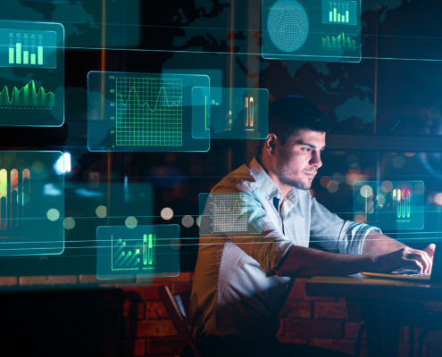 Collage With Businessman Working In Office And Digital Interface With Business Graphs